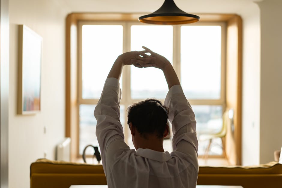 People doing stretching exercises in office break room